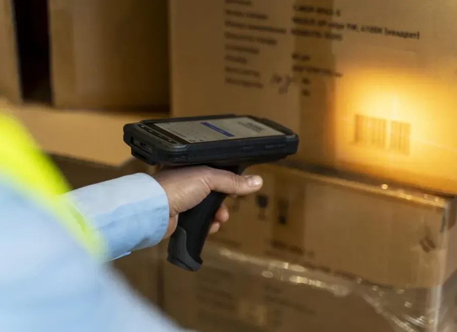 Scanning the barcode on a box with a handheld